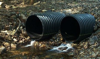 Leadmine Brook Perched Culverts Photo of the outlet of twin culverts perched above the streambed.  Improper culvert installation blocks and prevents upstream passage for the wild brook trout population.