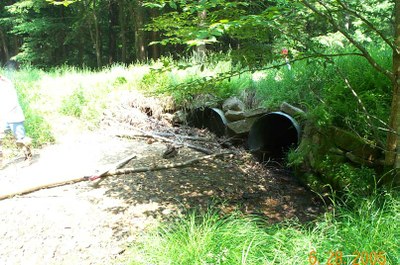 Culvert Inlet on Bobbs Creek in Pennsylvania Inlet of culverts on Bobbs Creek in Pennsylvania.  Note the accumulation of debris and near complete closure of the culvert on the far left.